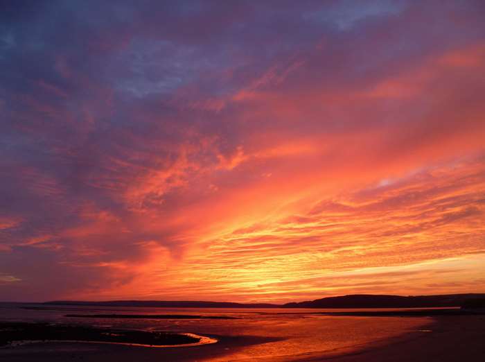 Sunset over Carmarthen Bay with colorful clouds