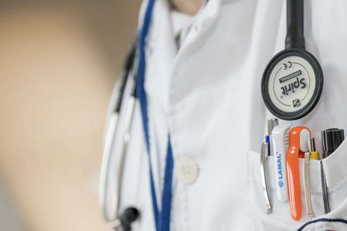 Doctor with stethoscope and medical instruments