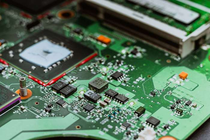 Close-up of a green computer circuit board with chips