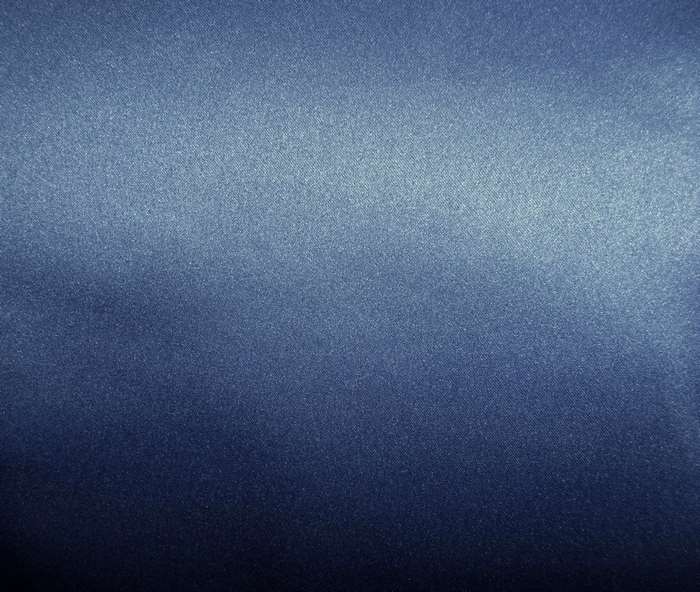 Blue satin fabric texture with light gradient