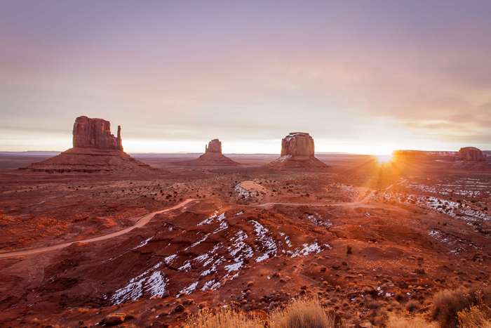 Monument Valley at sunrise with snow