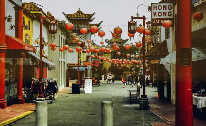 Chinatown street with Hong Kong Art Gallery sign and lanterns