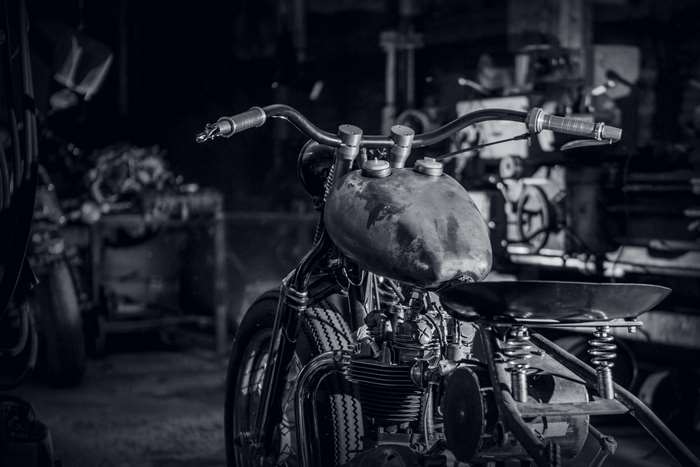 Custom Triumph Bobber Motorcycle in Garage 4K