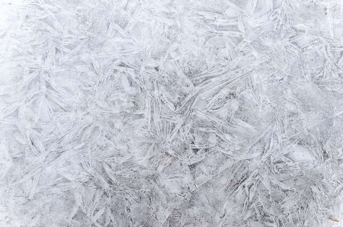 Abstract ice texture with sharp crystalline patterns