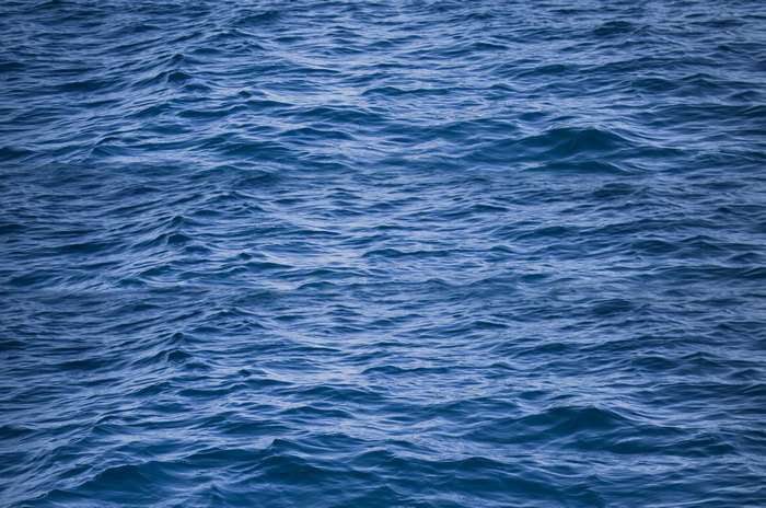 Blue ocean water surface with ripples