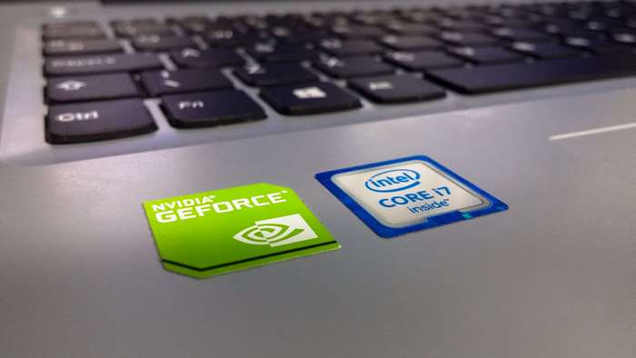 Nvidia GeForce and Intel Core i7 stickers on a laptop keyboard