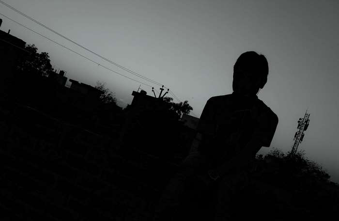 Silhouetted Boy Alone at Dusk 4K