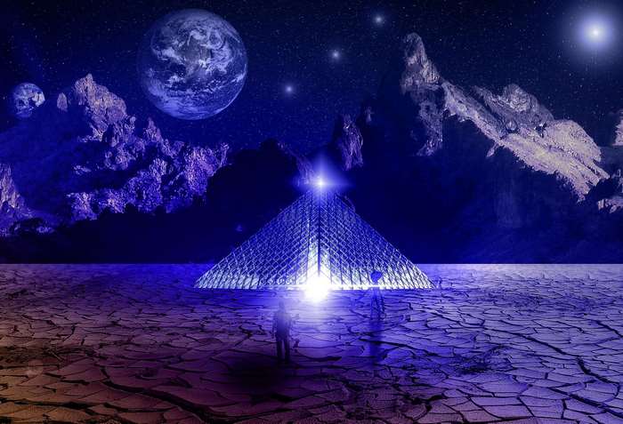Alien pyramid in a desert landscape with planets in the sky