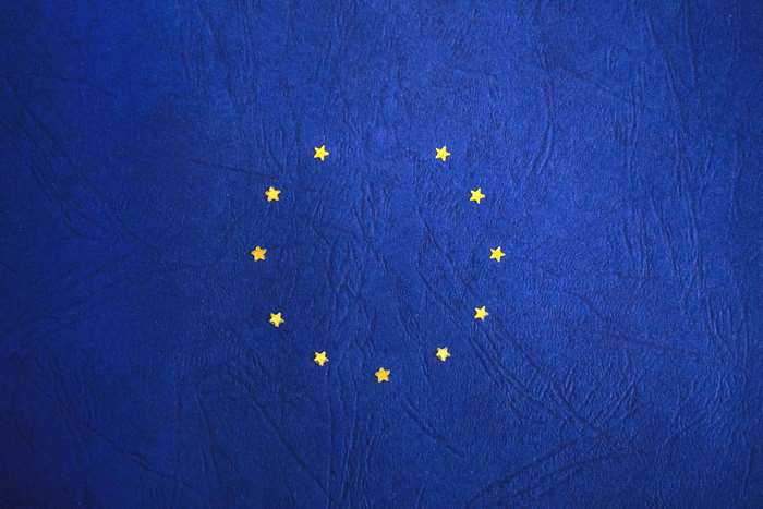 European Union Flag with Stars on Blue Background