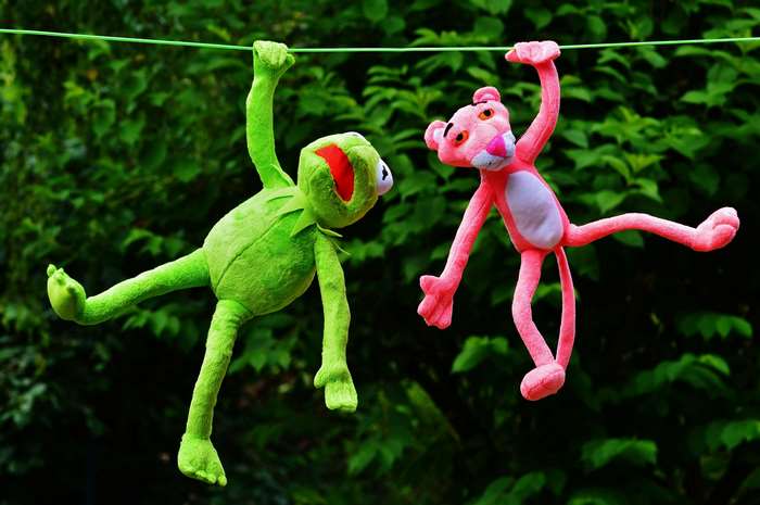 Kermit the Frog and Pink Panther plush toys hanging