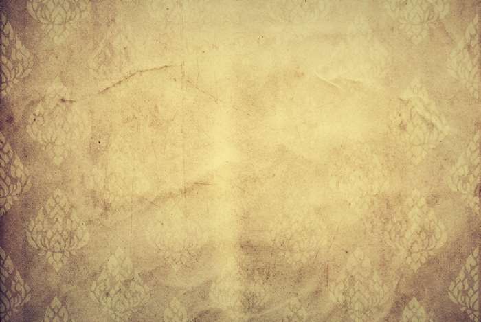 Aged paper with floral pattern overlay