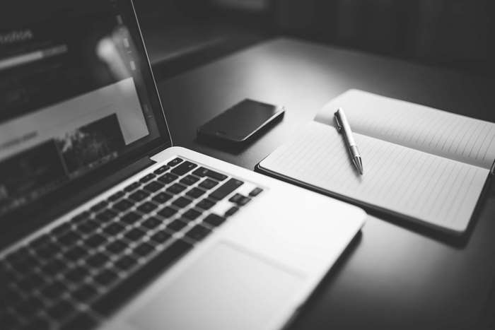 Laptop, Smartphone, and Notebook with Pen