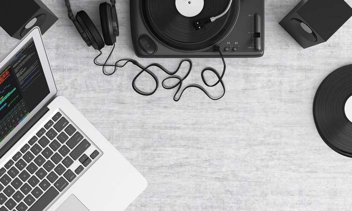 Laptop, turntable, headphones, speakers, and vinyl records