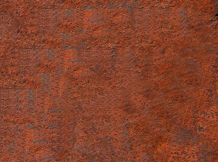 Rusted metal texture with orange and gray tones