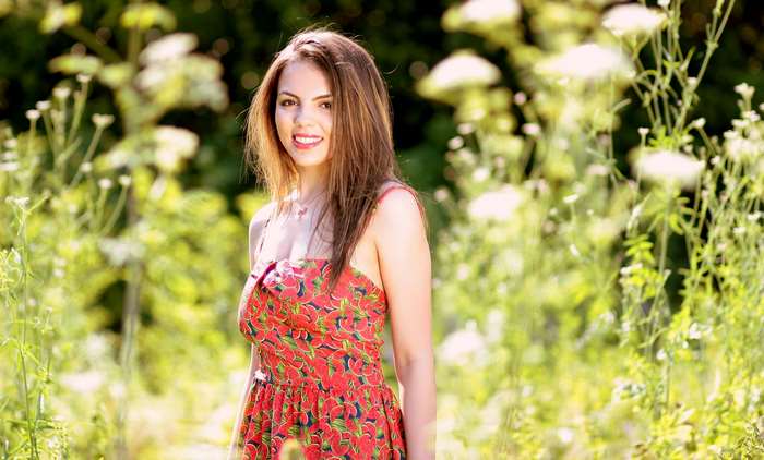 Girl in a floral dress in nature