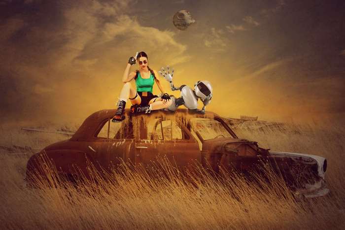 Lara Croft and robot on a car in a field