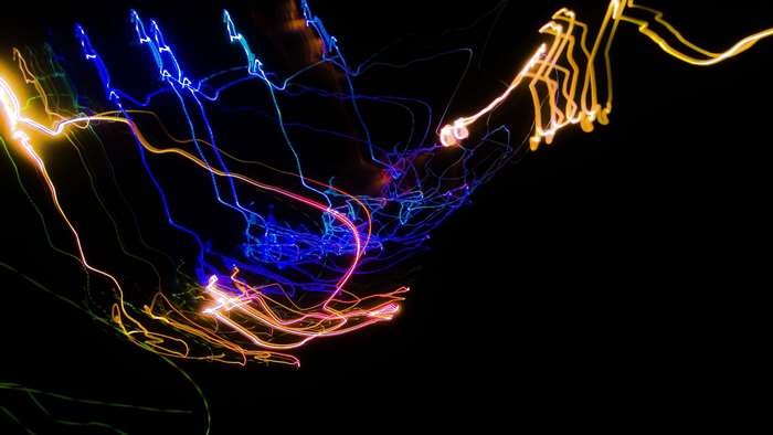 Abstract light painting with blue, yellow, and red streaks