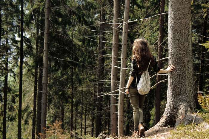 Woman walking in a forest