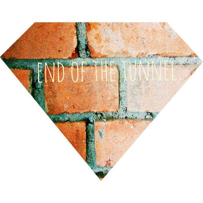 End of the Tunnel quote on brick wall