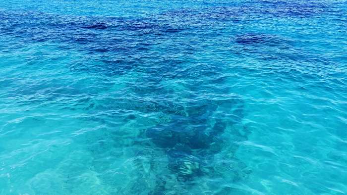 Clear turquoise ocean water with waves