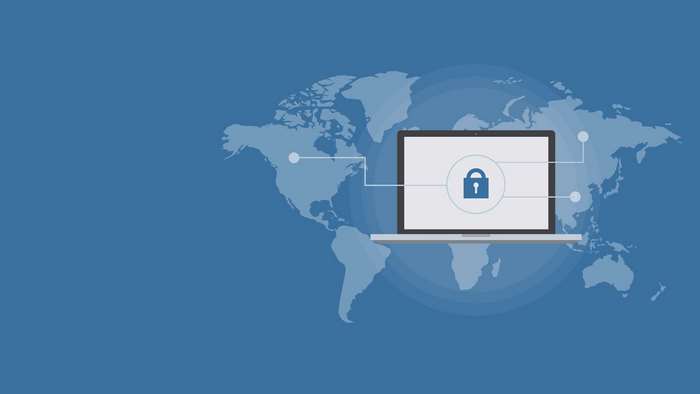 Laptop with lock icon on world map background