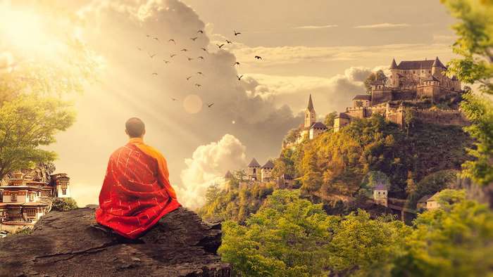 Meditating Buddhist Monk with Mountain Temple View