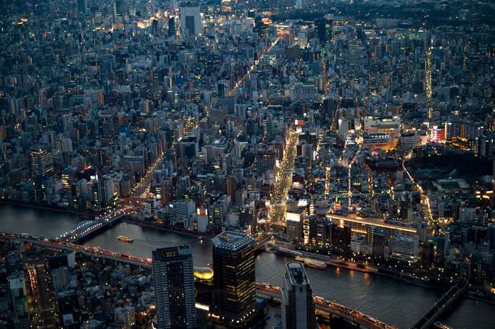 Tokyo cityscape at night with river and bridges