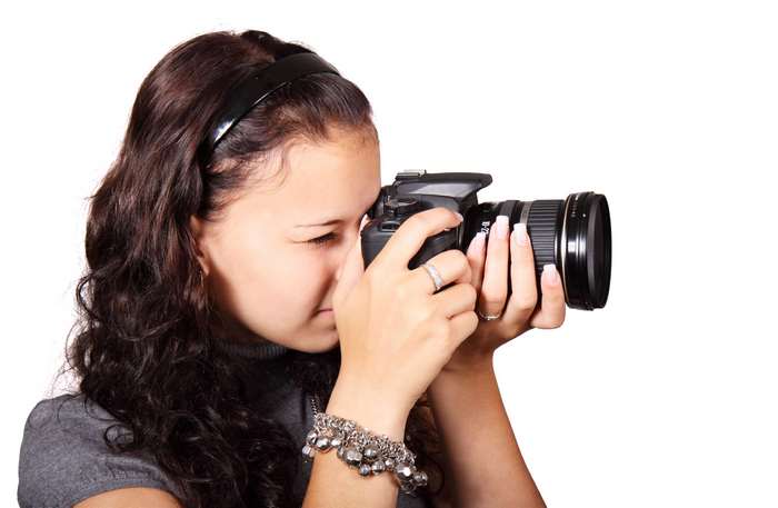 Woman taking a photo with a DSLR camera