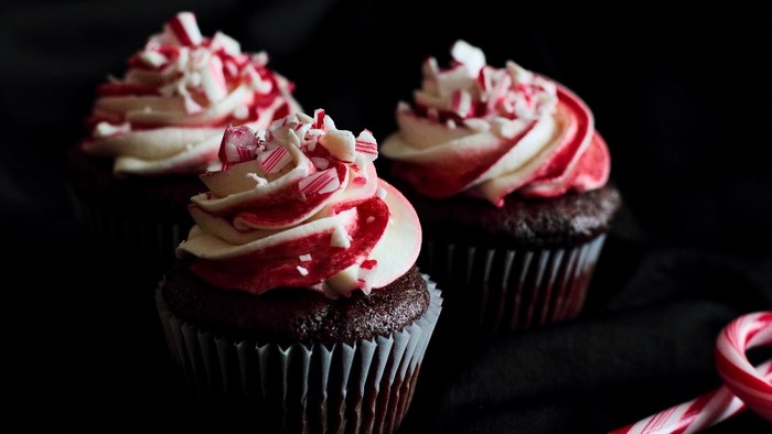 Chocolate cupcakes with peppermint frosting and candy cane pieces