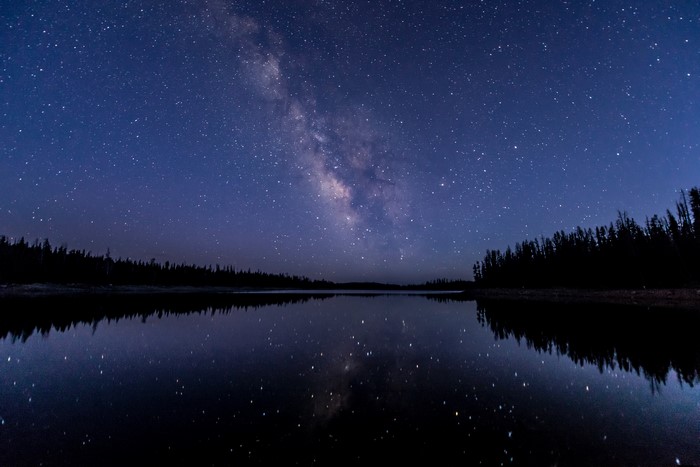 Milky Way over a calm lake at night