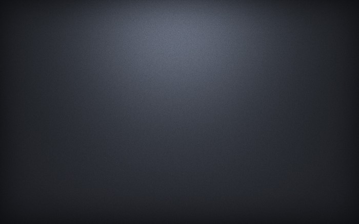 Dark gray textured surface with light gradient
