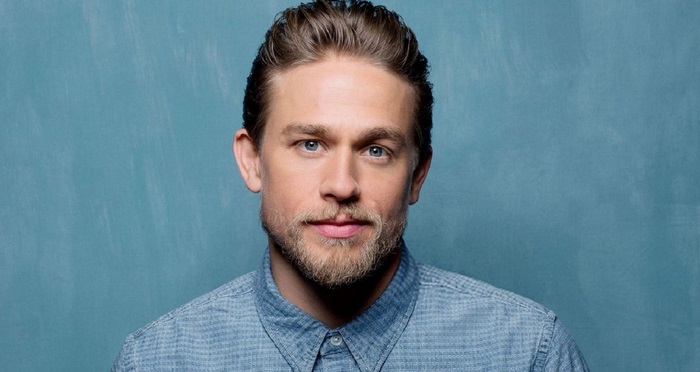 Charlie Hunnam actor with beard and blue eyes