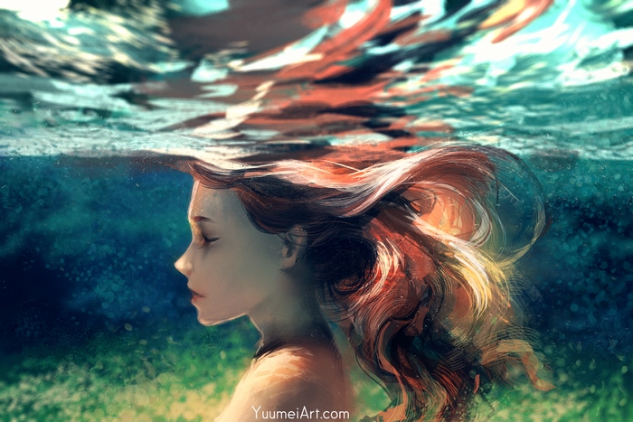 Girl with long red hair underwater