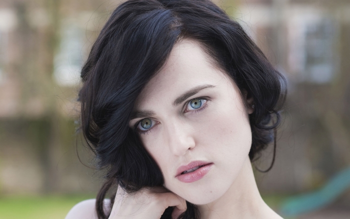Katie McGrath with black hair and blue eyes