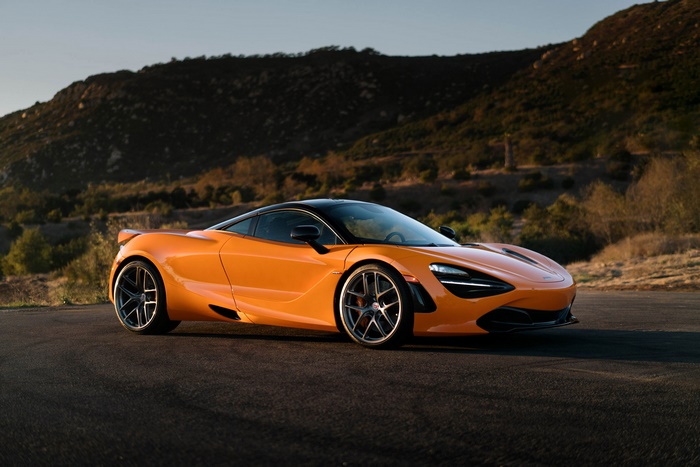 Orange McLaren 720S Supercar on a Road