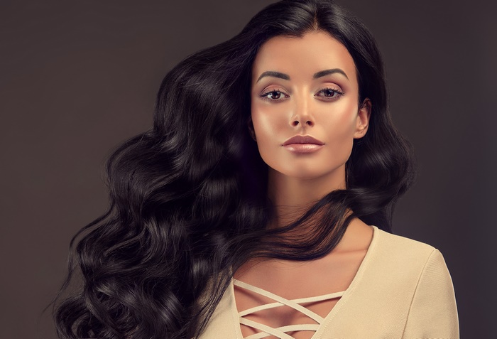 Woman with long black wavy hair