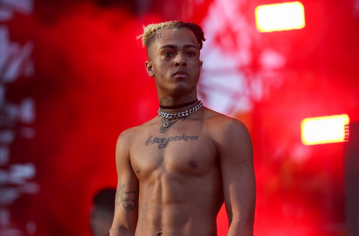 XXXTentacion Shirtless on Stage with Intense Red Lighting