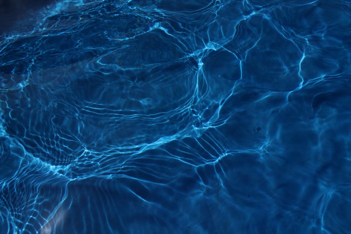 Blue Water Reflections with Light Patterns