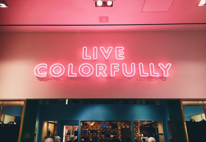 Neon sign that says LIVE COLORFULLY