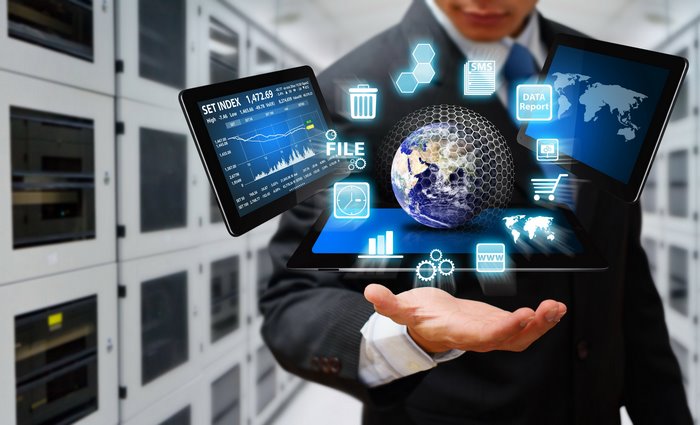 Man in suit with digital interfaces and globe