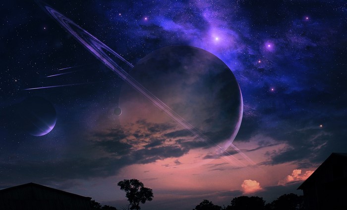 Fantasy planet with rings and nebulae in the night sky