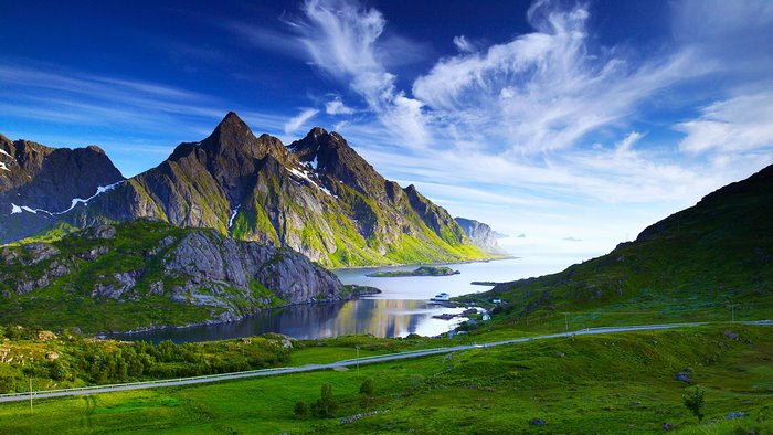Green mountains and ocean landscape