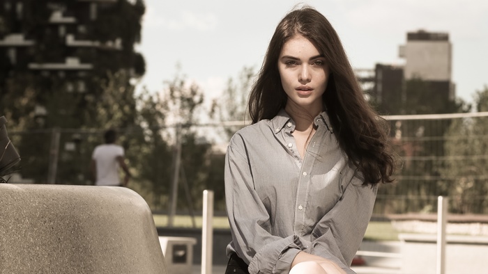 Model in a striped shirt outdoors