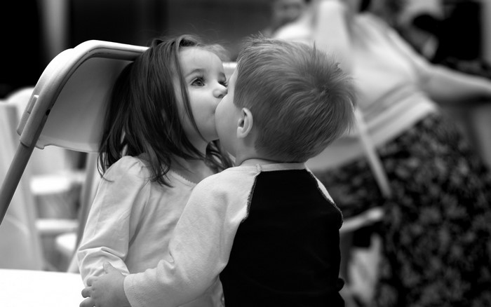 Children sharing a kiss