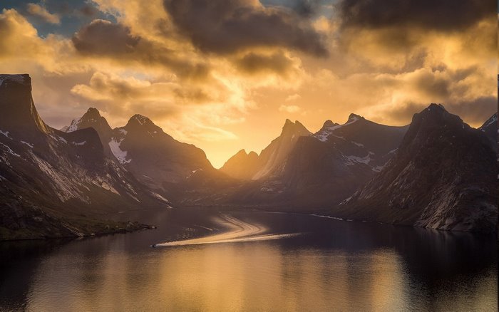 Sunset over mountains and fjord in Norway