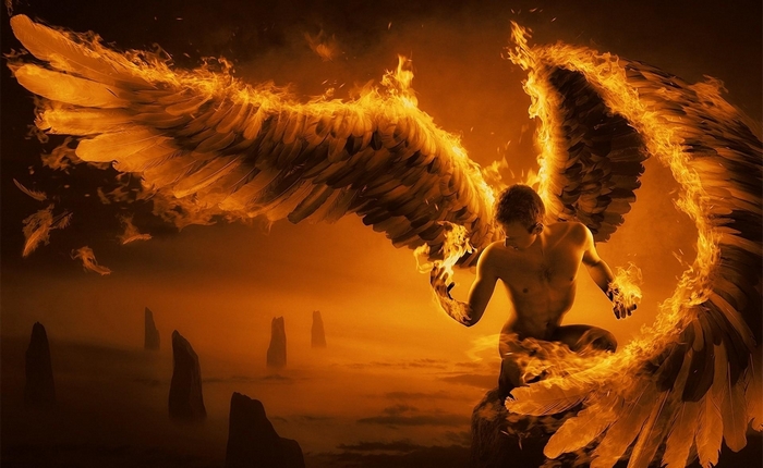 Angel with fiery wings in a mystical landscape