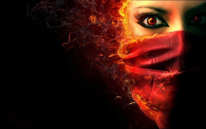 Woman with fiery mask and glowing eyes