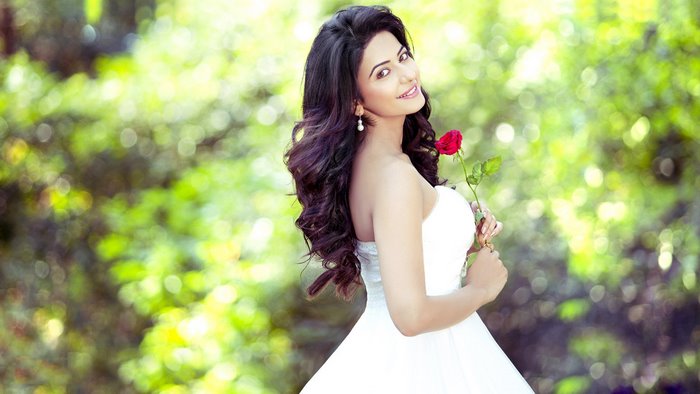 Rakul Preet Singh holding a red rose
