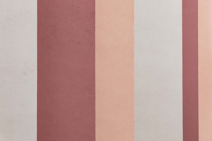 Vertical stripes of pastel colors on a textured surface