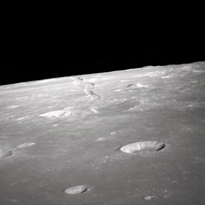 Lunar surface with craters and a winding path